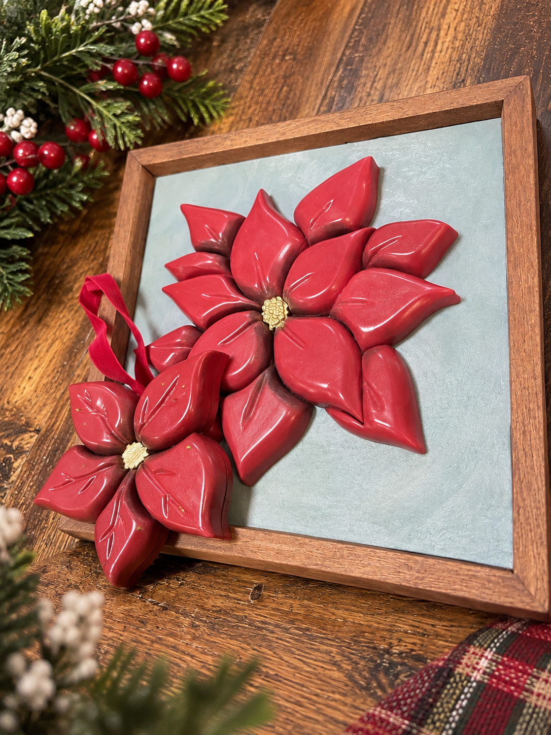 Wood poinsettia ornament in cozy holiday setting