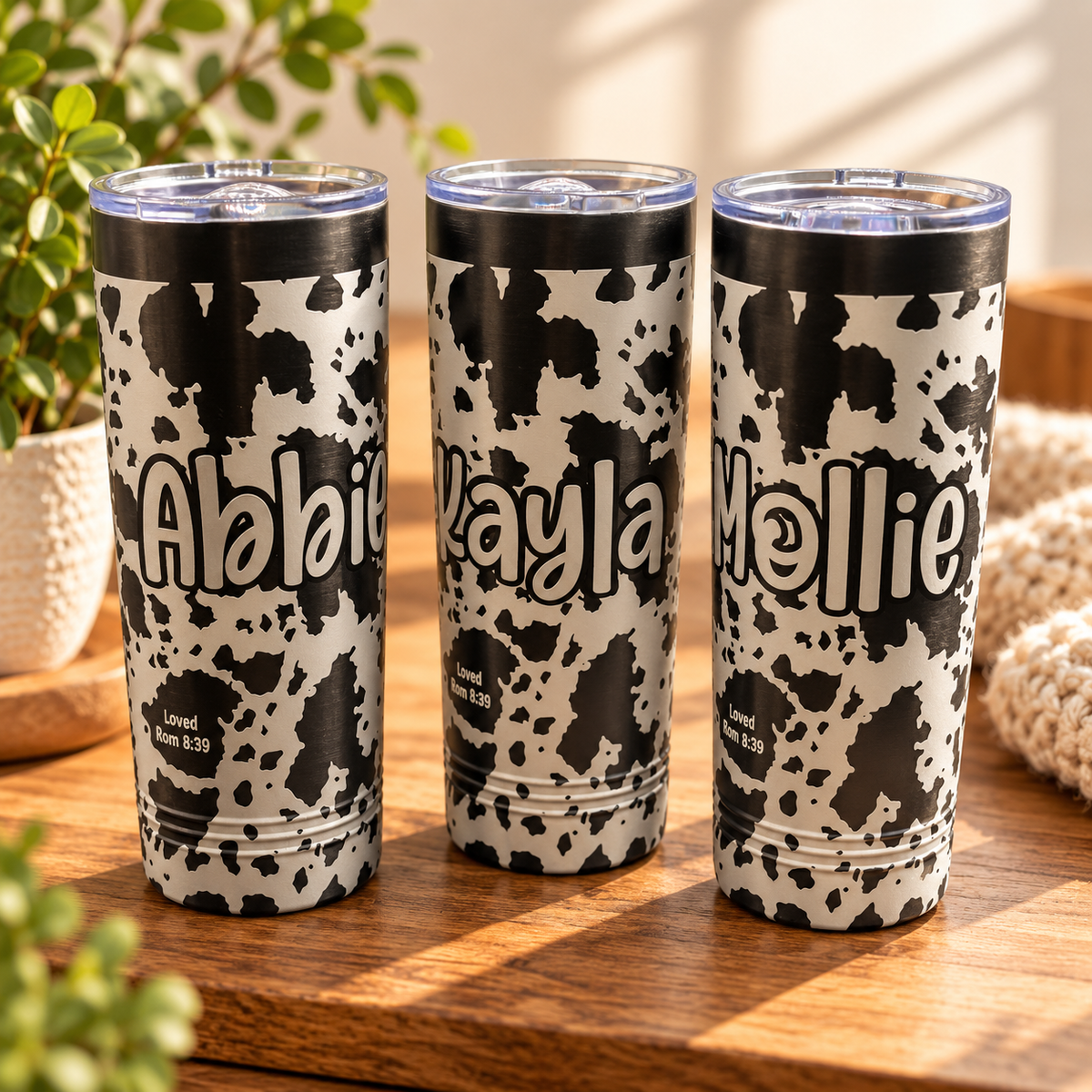 Personalized cow print tumbler with name engraving
